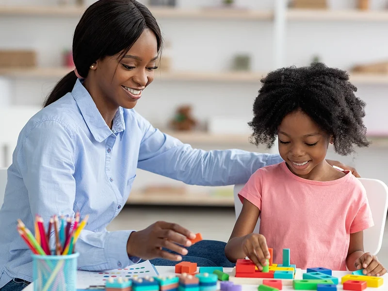 Therapist and child at the start of a session, getting comfortable