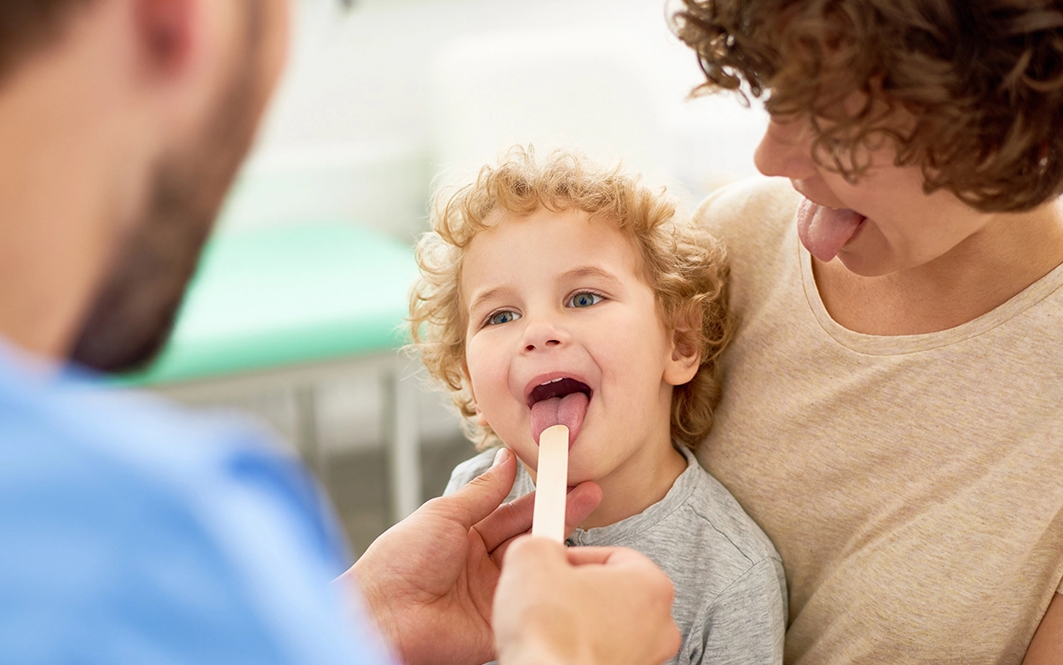 child at a table during a feeding therapy session